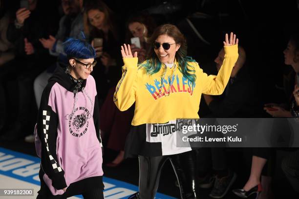 Designers Begum Berdan and Deniz Berdan acknowledgs the applause of the audience after the DB Berdan show during Mercedes Benz Fashion Week Istanbul...