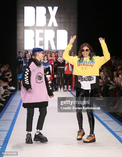 Designers Begum Berdan and Deniz Berdan acknowledgs the applause of the audience after the DB Berdan show during Mercedes Benz Fashion Week Istanbul...