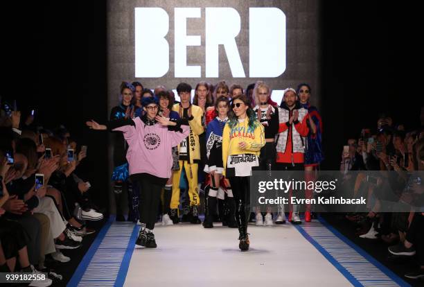 Designers Begum Berdan and Deniz Berdan acknowledgs the applause of the audience after the DB Berdan show during Mercedes Benz Fashion Week Istanbul...
