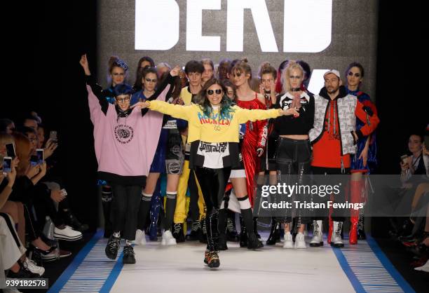 Designers Begum Berdan and Deniz Berdan acknowledgs the applause of the audience after the DB Berdan show during Mercedes Benz Fashion Week Istanbul...