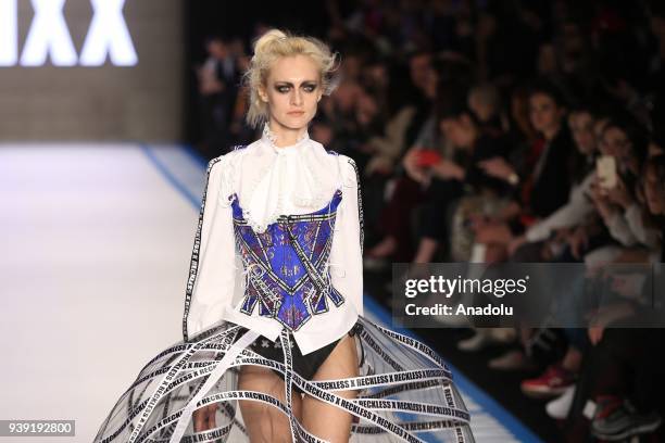 Model presents creations of designer Deniz Berdan during the Mercedes-Benz Fashion Week / Fall Season 2018 at the Zorlu Performing Arts Center in...