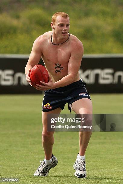 Adam Cooney of the Bulldogs looks to handball during a Western Bulldogs AFL training session at Whitten Oval on December 5, 2009 in Melbourne,...