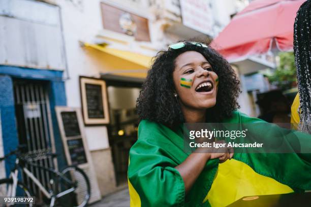 celebrating the victory in a street bar - moving down to seated position stock pictures, royalty-free photos & images