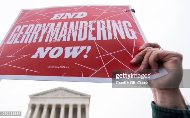 Gerrymandering activists gather on the steps of the Supreme Court as the court prepares to hear the the Benisek v. Lamone case on Wednesday, March...