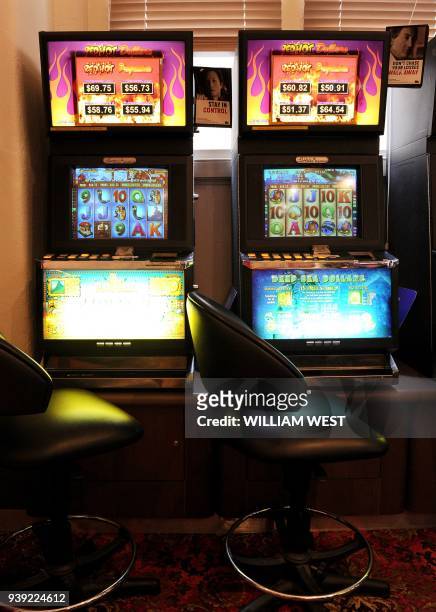 Photo taken in Melbourne on April 13 shows a general view taken inside a gaming venue with poker machines. An Australian MP leading a push against...