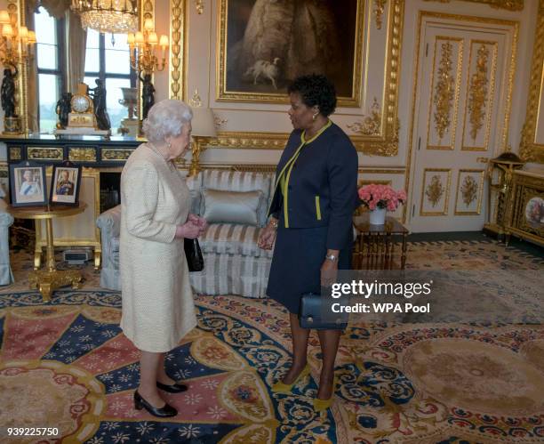 Queen Elizabeth II receives Governor-General of Barbados Dame Sandra Mason during a private audience at Buckingham Palace on March 28, 2018 in...