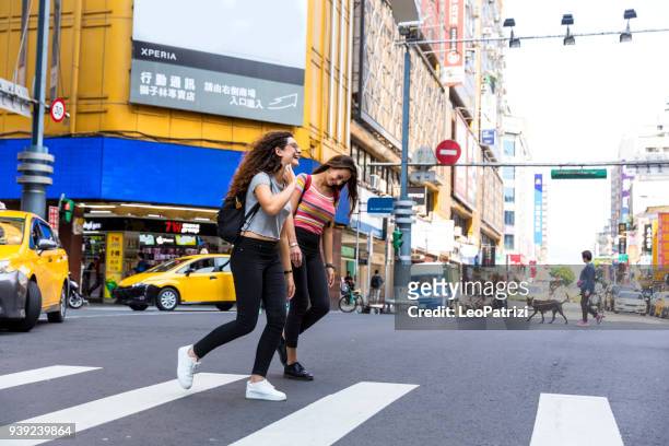 friends traveling abroad to asia - ximen stock pictures, royalty-free photos & images