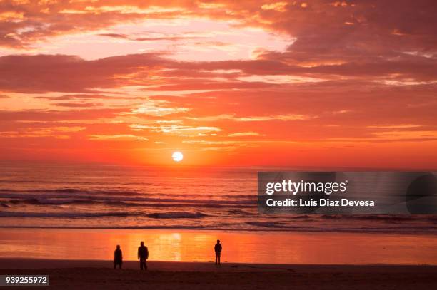 sunset in the lanzada beach - romantic sky stock pictures, royalty-free photos & images