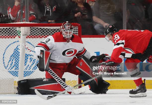 Scott Darling of the Carolina Hurricanes skates against the New Jersey Devils at the Prudential Center on March 27, 2018 in Newark, New Jersey.