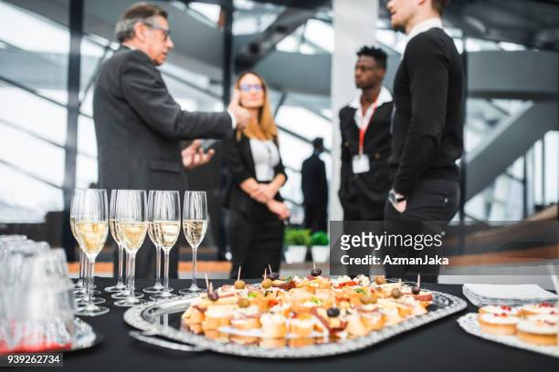 businesspeople having a meet and greet with potential clients - food and drink industry stock pictures, royalty-free photos & images
