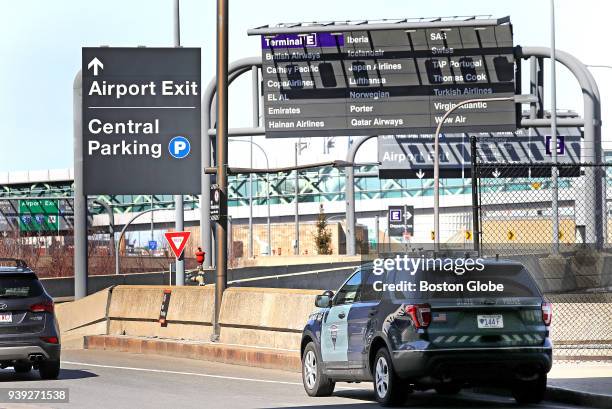 Massachusetts State Police vehicle patrols near Logan Airport in Boston on March 27, 2018. Revelations about an alleged overtime scam, a wave of...