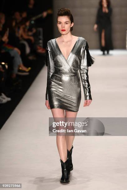 Model walks the runway at the Belma Ozdemir show during Mercedes Benz Fashion Week Istanbul at Zorlu Performance Hall on March 28, 2018 in Istanbul,...