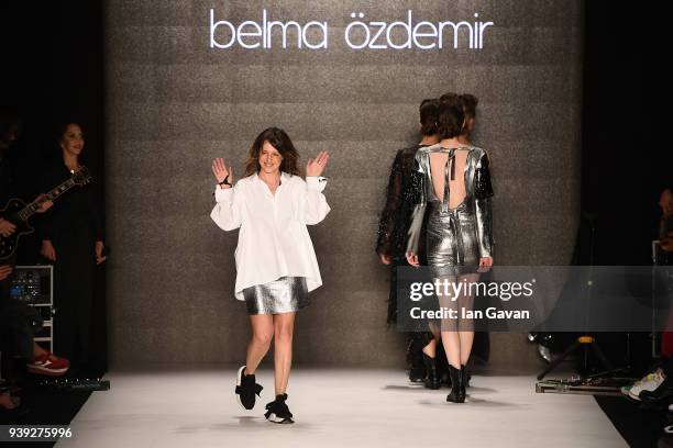Fashion designer Belma Ozdemir walks the runway after her show during Mercedes Benz Fashion Week Istanbul at Zorlu Performance Hall on March 28, 2018...