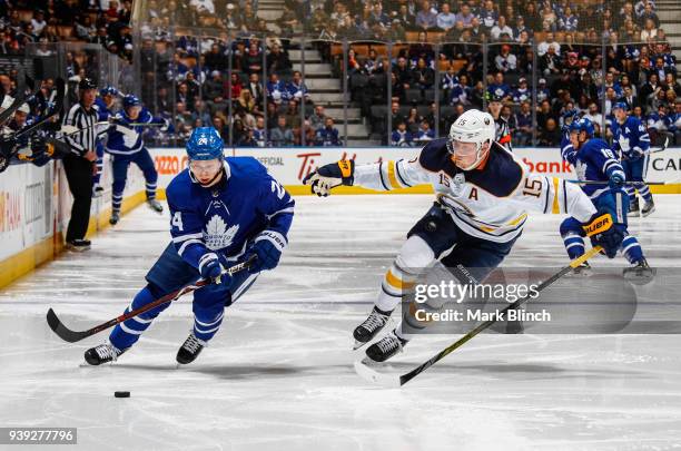 Kasperi Kapanen of the Toronto Maple Leafs skates against Jack Eichel of the Buffalo Sabres during the third period at the Air Canada Centre on March...