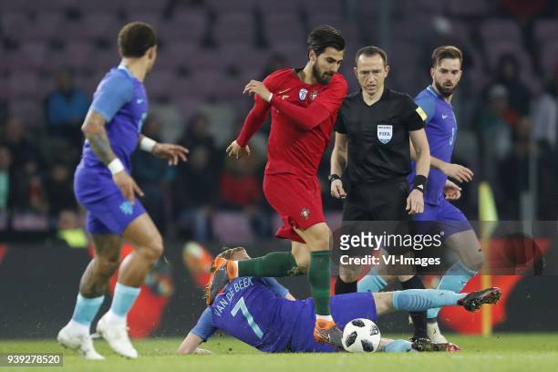 Memphis Depay of Holland, Donny van de Beek of Holland, Andre Gomes of Portugal, referee Ruddy Buquet, Davy Propper of Holland during the...