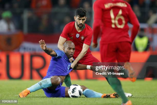 Ryan Babel of Holland, Luis Neto of Portugal during the International friendly match match between Portugal and The Netherlands at Stade de Genève on...