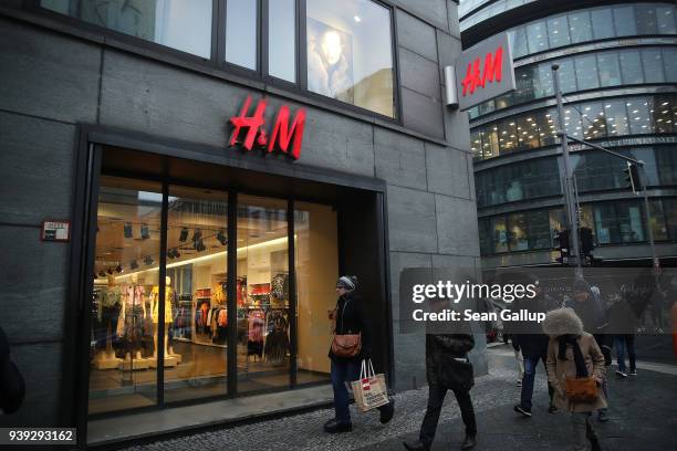 People walk past a store of Swedish clothing retailer H&M on March 28, 2018 in Berlin, Germany. H&M, which is the world's second largest clothing...