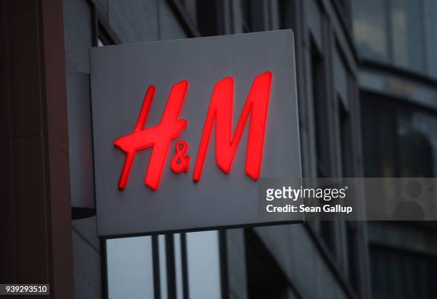 The logo of Swedish clothing retailer H&M hangs over one of its stores on March 28, 2018 in Berlin, Germany. H&M, which is the world's second largest...