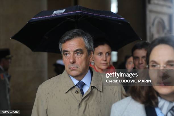 Former French Prime Minister Francois Fillon leaves after a national ceremony for Lieutenant-Colonel Arnaud Beltrame, on March 28, 2018 at the Hotel...