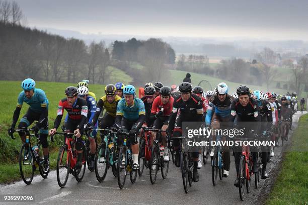 The pack ride in the 73rd edition of the "Dwars Door Vlaanderen" cycling race, a 180,1 kilometre race from Roeselare to Waregem, on March 28, 2018. /...