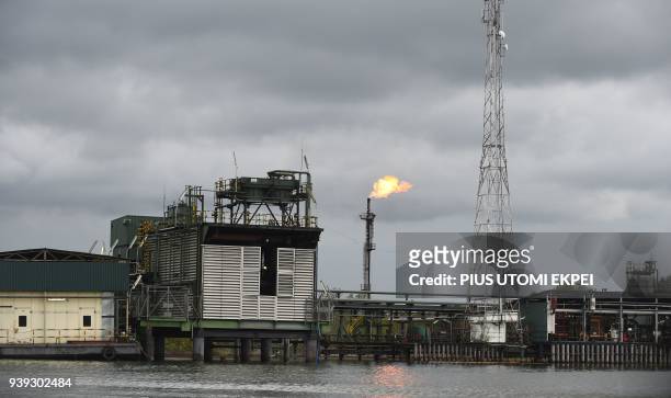 Gas flare burns at the Batan flow station operated by Chevron under a joint-venture arrangement with the Nigerian National Petroleum Corporation for...