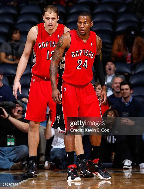 Sonny Weems and Rasho Nesterovic of the Toronto Raptors against the Atlanta Hawks at Philips Arena on December 2, 2009 in Atlanta, Georgia. NOTE TO...