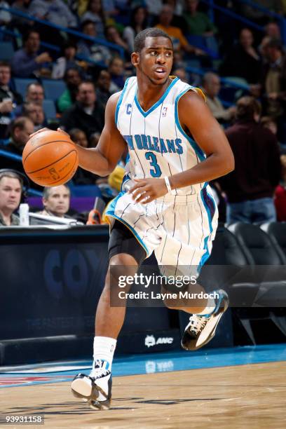 Chris Paul of the New Orleans Hornets drives against the Minnesota Timberwolves on December 4, 2009 at the New Orleans Arena in New Orleans,...