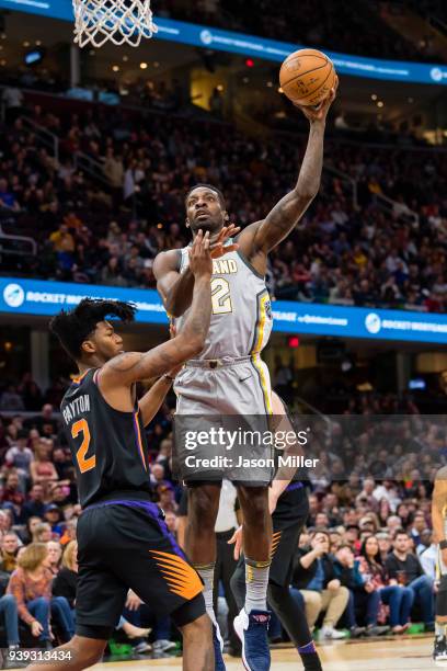 Jeff Green of the Cleveland Cavaliers shoots over Elfrid Payton of the Phoenix Suns during the first half at Quicken Loans Arena on March 23, 2018 in...