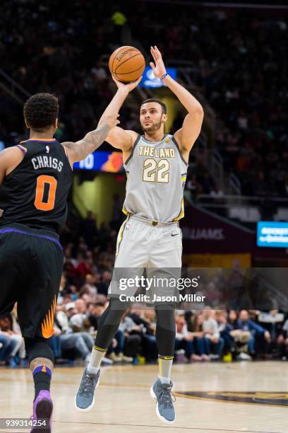 Larry Nance Jr. #22 of the Cleveland Cavaliers shoots over Marquese Chriss of the Phoenix Suns during the first half at Quicken Loans Arena on March...