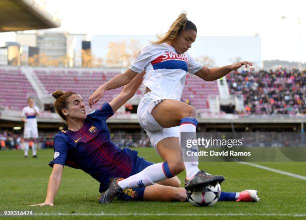 Delphine Cascarino of Olympique Lyon is tackled by Melanie Serrano of FC Barcelona during the UEFA Women's Champions League Quarter Final 2nd Leg...