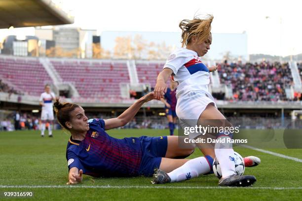 Delphine Cascarino of Olympique Lyon is tackled by Melanie Serrano of FC Barcelona during the UEFA Women's Champions League Quarter Final 2nd Leg...