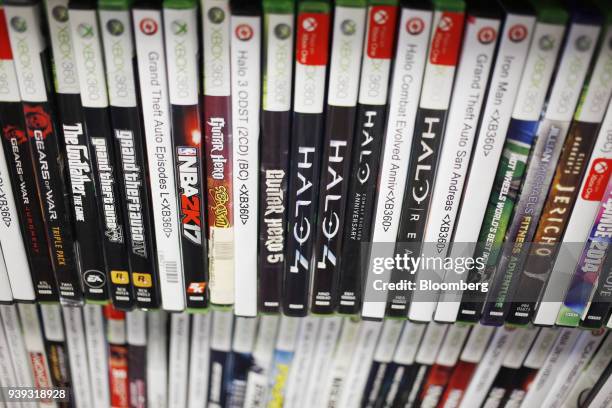 Pre-owned Microsoft Corp. Xbox 360 video games are displayed for sale inside a GameStop Corp. Store in Louisville, Kentucky, U.S., on Thursday, March...