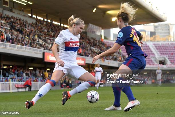Ada Hegerberg of Olympique Lyon is challenged by María León of FC Barcelona during the UEFA Women's Champions League Quarter Final 2nd Leg between FC...