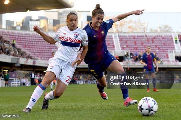 Delphine Cascarino of Olympique Lyon is tackled by Melanie Serrano of FC Barcelona during the UEFA Women's Champions League Quarter Final 2nd Leg...