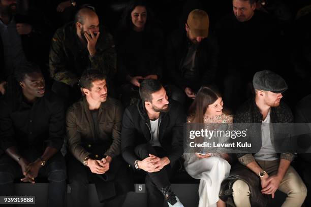 Bafetimbi Gomis, Emre Belezoglu, Arda Turan, guest and Ogulcan Engin attend the St. Nian show during Mercedes Benz Fashion Week Istanbul at Zorlu...