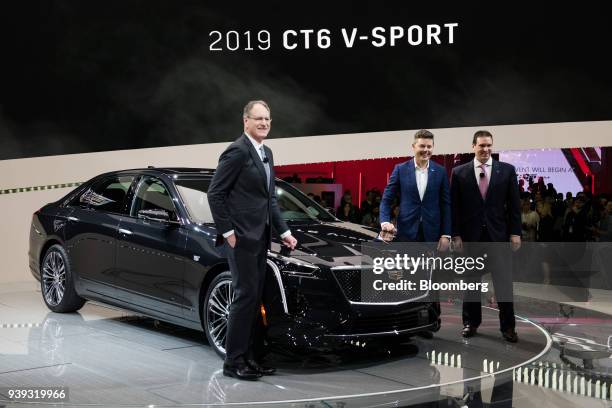 Johan de Nysschen, president of the General Motors Co. Cadillac unit, left, stands for a photograph next to the Cadillac CT6 V-Sport vehicle during...