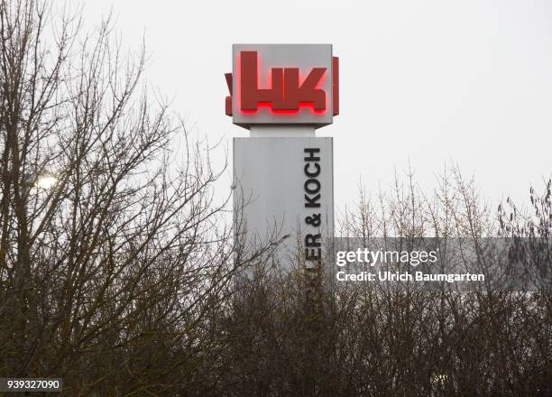 Exterior view of the headquarters of the weapons manufacturer Heckler & Koch in Oberndorf - iluminated logo.