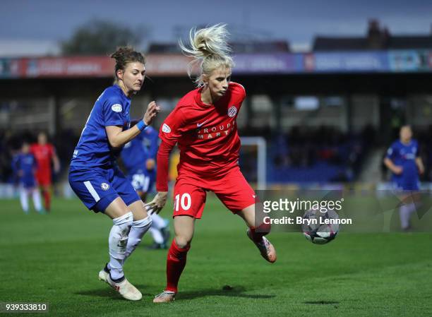 Sofia Jakobsson of Montpellier is tackled by Hannah Blundell of Chelsea during the UEFA Womens Champions League Quarter-Final second leg match...