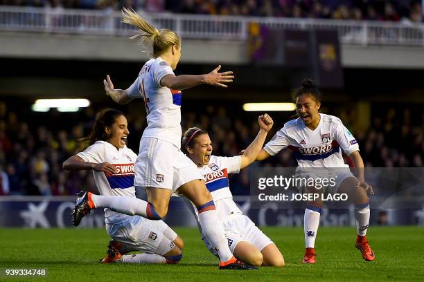 Lyon's French forward Eugenie Le Sommer celebrates her goal with teammates during the UEFA Women's Champions League quarter-final second leg football...