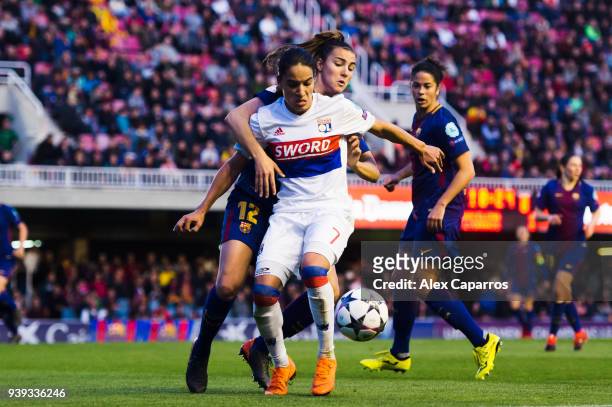 Amel Majri of Olympique Lyon controls the ball under pressure from Patricia Guijarro of FC Barcelona during the UEFA Women's Champions League Quarter...