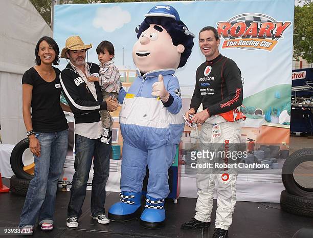 Television presenter Paul McDermott, his wife Elisa and son Xavier pose with Team Vodafone V8 driver Craig Lowndes at the Roary VIP Pit Party prior...