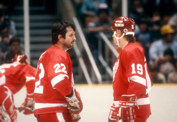 brad-park-and-steve-yzerman-of-the-detroit-red-wings-talk-on-the-ice-during-an-nhl-game.jpg