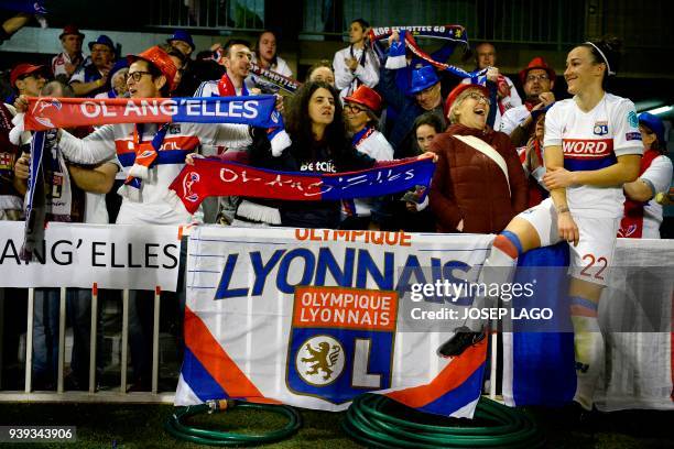 Lyon's British defender Lucy Bronze celebrates her team's victory with fans at the end of the UEFA Women's Champions League quarter-final second leg...