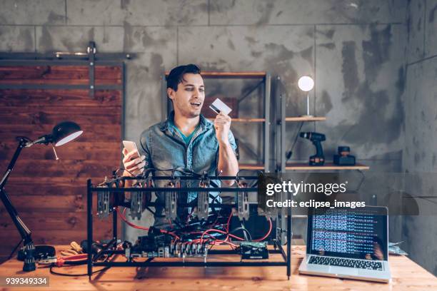 programmer preparing mining rig with gpu - web programmer stock pictures, royalty-free photos & images