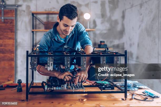 programmer preparing mining rig with gpu - web programmer stock pictures, royalty-free photos & images
