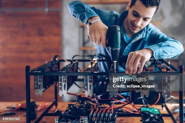 programmer preparing mining rig with gpu - web programmer stock pictures, royalty-free photos & images