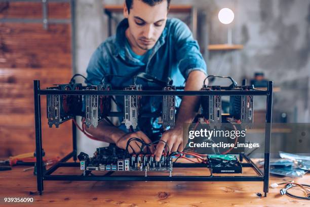 programmer preparing mining rig with gpu - web programmer stock pictures, royalty-free photos & images