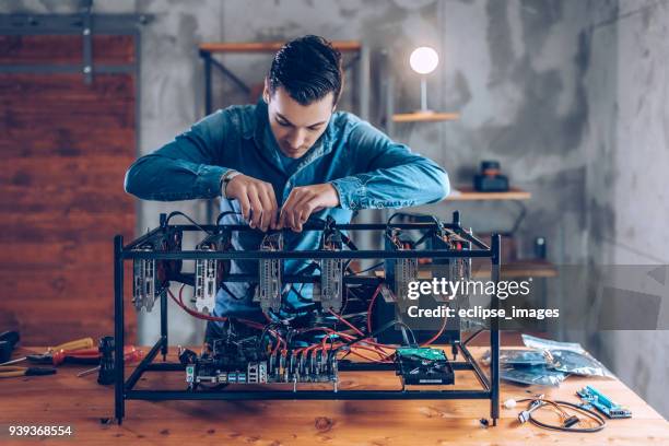 programmer preparing mining rig with gpu - web programmer stock pictures, royalty-free photos & images