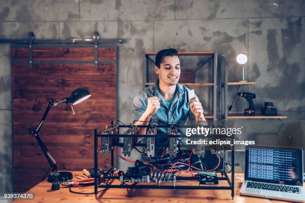 programmer preparing mining rig with gpu - web programmer stock pictures, royalty-free photos & images