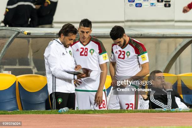 Mohamed Nahiri of Morocco and Oualid Azarou of Morocco get instructions during the international friendly match between Morocco and Uzbekistan at the...